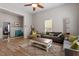 Cozy living room with warm wood floors, comfortable seating, and ample natural light at 208 S Guthrie Ave, Durham, NC 27703