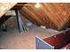 Unfinished attic storage area with plywood flooring and exposed wood beams at 218 Keith Hills Rd, Lillington, NC 27546