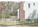 The backyard includes a wooden deck, privacy fence, and a brick chimney at 218 Keith Hills Rd, Lillington, NC 27546