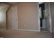 Bedroom featuring neutral walls, carpeted floor, and a bathroom entrance at 218 Keith Hills Rd, Lillington, NC 27546