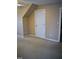 Bedroom featuring neutral walls, angled ceiling, carpeted floor, and a door at 218 Keith Hills Rd, Lillington, NC 27546