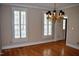 Dining room features hardwood floors, crown molding, plantation shutters, and a chandelier at 218 Keith Hills Rd, Lillington, NC 27546