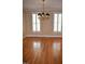 Traditional dining room features hardwood floors, plantation shutters, and an elegant chandelier at 218 Keith Hills Rd, Lillington, NC 27546