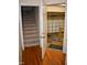 Entryway featuring wood floors and an open door to the garage and carpeted stairs at 218 Keith Hills Rd, Lillington, NC 27546