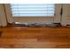 Damaged flooring featuring wood-style planks and damage at 218 Keith Hills Rd, Lillington, NC 27546