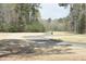 Lush green golf course landscape with a winding path and mature trees at 218 Keith Hills Rd, Lillington, NC 27546