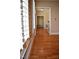 Hallway with hardwood floors and light-filled rooms at 218 Keith Hills Rd, Lillington, NC 27546