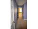 Hallway featuring blue walls, carpeted floor, and a peek at the landing with wooden railing at 218 Keith Hills Rd, Lillington, NC 27546
