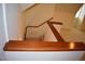 Stairwell with a dark wood railing at 218 Keith Hills Rd, Lillington, NC 27546