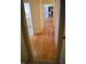 Hallway with beautiful hardwood floors leading to other rooms of the house at 218 Keith Hills Rd, Lillington, NC 27546