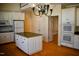 Spacious kitchen with a large island, white cabinetry, and stainless steel appliances at 218 Keith Hills Rd, Lillington, NC 27546