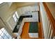 Overhead shot of bright kitchen featuring an island, white cabinets, and hardwood floors at 218 Keith Hills Rd, Lillington, NC 27546