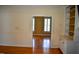 View of a living room that leads to another room with bright sunlight at 218 Keith Hills Rd, Lillington, NC 27546