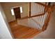 Carpeted stairs leading to the wood-paneled front door with sidelights at the bottom at 218 Keith Hills Rd, Lillington, NC 27546