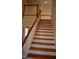 Staircase features painted risers, wood treads, and a white-painted handrail at 218 Keith Hills Rd, Lillington, NC 27546
