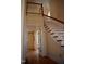 Stairway has hardwood steps, white risers and railing, and natural light at 218 Keith Hills Rd, Lillington, NC 27546