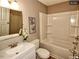 Well-lit bathroom featuring a vanity, toilet, and shower-tub combo at 220 Barclay Rd, Chapel Hill, NC 27516