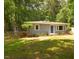 Charming single-story home featuring a well-maintained lawn and mature trees at 220 Barclay Rd, Chapel Hill, NC 27516