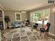Open-concept living room with hardwood floors, bright light, and neutral colors at 220 Barclay Rd, Chapel Hill, NC 27516