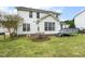 White home featuring a back deck and backyard space with green grass at 2310 Nutting Ln, Apex, NC 27523