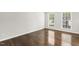 Bright bedroom featuring hardwood floors and neutral walls at 2310 Nutting Ln, Apex, NC 27523