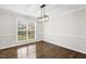 Cozy dining room featuring hardwood floors and an elegant light fixture at 2310 Nutting Ln, Apex, NC 27523