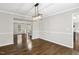 Dining room with hardwood floors, neutral paint, and an open layout at 2310 Nutting Ln, Apex, NC 27523