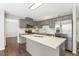 Updated kitchen with gray cabinetry, stainless appliances and island at 2310 Nutting Ln, Apex, NC 27523