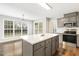 Kitchen island with light countertop, stainless appliances and open floor plan at 2310 Nutting Ln, Apex, NC 27523