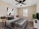 Staged bedroom with grey comforter and decorator accents at 251 W Moffitt Avenue, Liberty, NC 27298