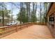 Spacious wooden deck with railings and views of the backyard at 251 W Moffitt Avenue, Liberty, NC 27298