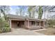 Cozy brick ranch home with a covered front porch and a small front yard at 251 W Moffitt Avenue, Liberty, NC 27298