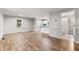 Open floor plan featuring new wood floors and a view of the kitchen and living space at 251 W Moffitt Avenue, Liberty, NC 27298