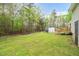 Backyard features a green lawn with a shed and deck at 2603 Brogden Rd, Creedmoor, NC 27522
