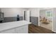 Updated eat-in kitchen with modern flooring, neutral walls, and a convenient bar area at 2603 Brogden Rd, Creedmoor, NC 27522