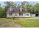 Charming Cape Cod style home with dormers, green lawn, and mature trees at 2603 Brogden Rd, Creedmoor, NC 27522
