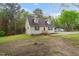 Quaint single-Gathering home nestled amongst mature trees with a well-manicured lawn at 2603 Brogden Rd, Creedmoor, NC 27522
