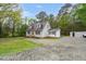 Charming home featuring dormer windows, wood siding, and a gravel driveway at 2603 Brogden Rd, Creedmoor, NC 27522