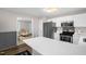 Modern eat-in kitchen featuring stainless steel appliances and white countertops at 2603 Brogden Rd, Creedmoor, NC 27522