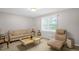 Bright living room with a large window, comfortable seating, and neutral decor at 2603 Brogden Rd, Creedmoor, NC 27522