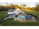 Expansive property boasting a well-maintained home, mature trees, outbuildings and an in-ground pool at 2905 Glendale Rd, Kenly, NC 27542