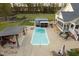 Sprawling property featuring a large backyard with an in-ground pool, outbuildings, and lush green landscaping at 2905 Glendale Rd, Kenly, NC 27542