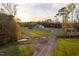 Overhead view of a property featuring a well-kept lawn, mature trees, and a peaceful setting at 2905 Glendale Rd, Kenly, NC 27542