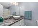 Bathroom with marble counters, modern vessel sink, and neutral paint at 2905 Glendale Rd, Kenly, NC 27542