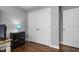Bedroom featuring hardwood floors, white trim, and closet storage at 2905 Glendale Rd, Kenly, NC 27542