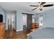 Well-lit bedroom with wooden floors, slider to the bath and hallway leading into other parts of the house at 2905 Glendale Rd, Kenly, NC 27542