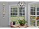 Bright dining area with hardwood floors and a large window with a view at 2905 Glendale Rd, Kenly, NC 27542