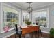 Bright dining area with hardwood floors, bay windows and modern chandelier at 2905 Glendale Rd, Kenly, NC 27542