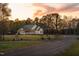 Charming single-story home with a welcoming front porch, nestled on a spacious lot with lush trees at 2905 Glendale Rd, Kenly, NC 27542