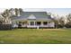 Welcoming one-story home with a charming front porch, complemented by a well-manicured front yard at 2905 Glendale Rd, Kenly, NC 27542